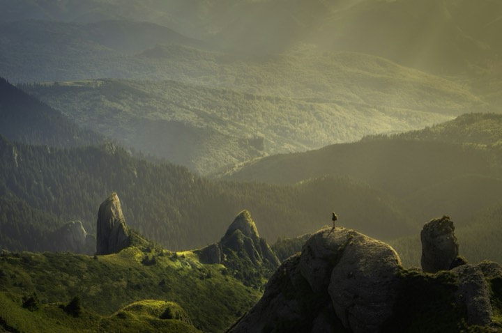 Hiker above a misty valley